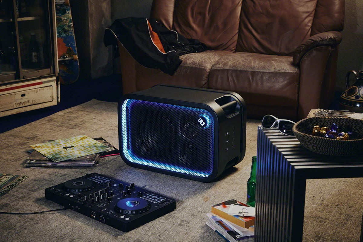 Sony ULT Tower 5 speaker beside a couch and DJ pad